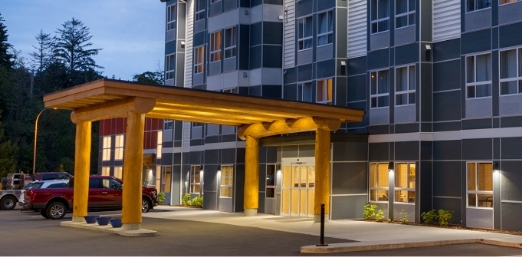 microtel-ladysmith-bc-exterior-1289920s The entrance to a hotel with a red truck in the backgroung