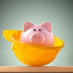 piggy bank in a yellow hard hat